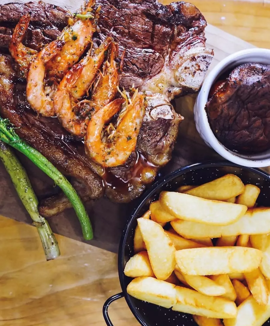 Traditional dish being served at the Rico Saber